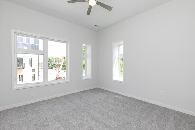 225 Maple St, Des Moines, IA 50309 - carpeted empty room with visible vents, baseboards, and a ceiling fan