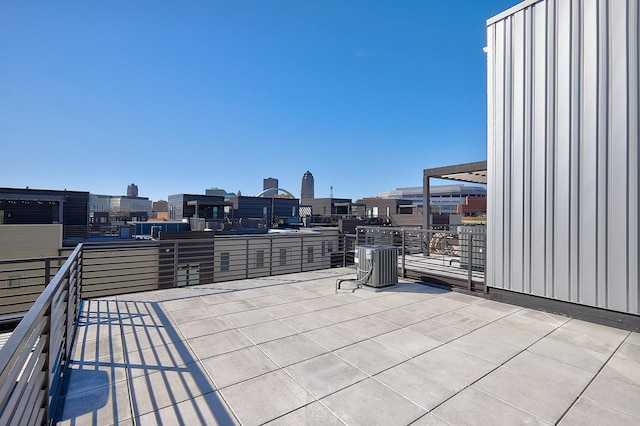 view of patio with a balcony and central AC