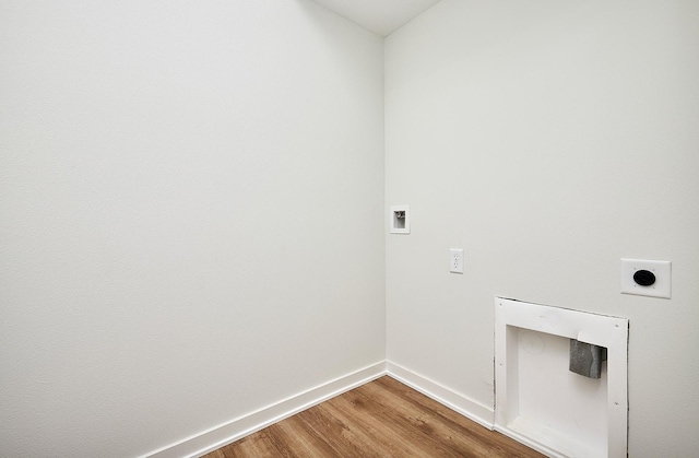 laundry area featuring laundry area, wood finished floors, washer hookup, hookup for an electric dryer, and baseboards