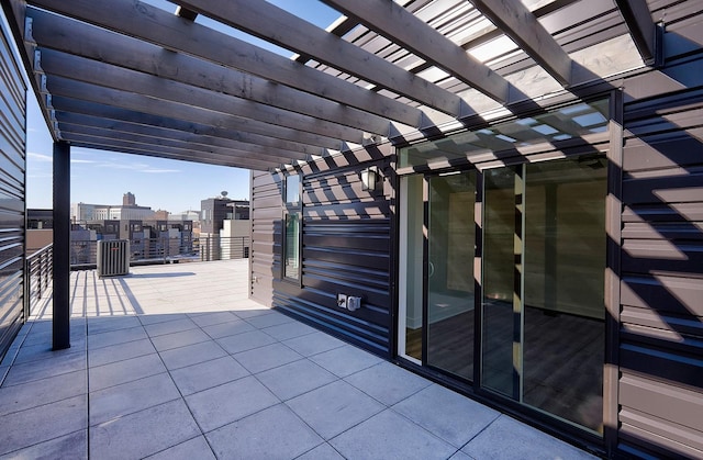 view of patio with a city view and a pergola
