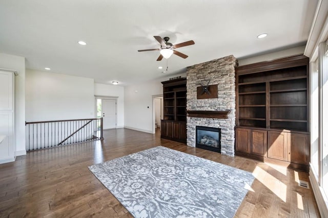 2102 NW 24th St, Ankeny, IA 50023 - living area featuring ceiling fan, a fireplace, wood finished floors, and recessed lighting