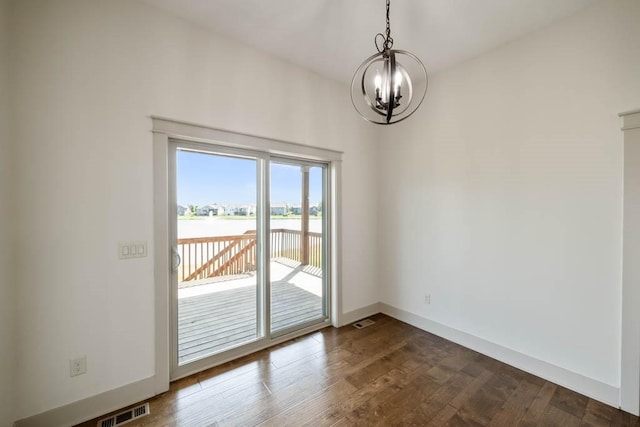 2102 NW 24th St, Ankeny, IA 50023 - empty room featuring a chandelier, dark wood-style floors, and a water view