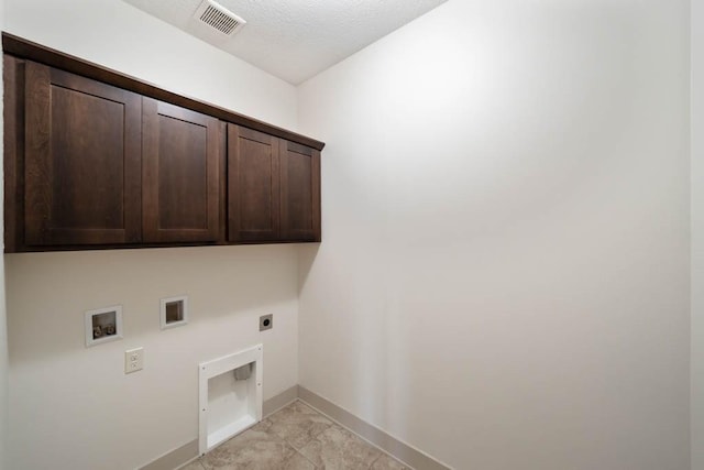 2102 NW 24th St, Ankeny, IA 50023 - laundry room with hookup for an electric dryer, cabinet space, and hookup for a washing machine