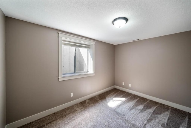 2102 NW 24th St, Ankeny, IA 50023 - carpeted empty room with a textured ceiling and baseboards