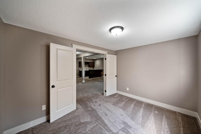 2102 NW 24th St, Ankeny, IA 50023 - empty room featuring carpet flooring and a textured ceiling