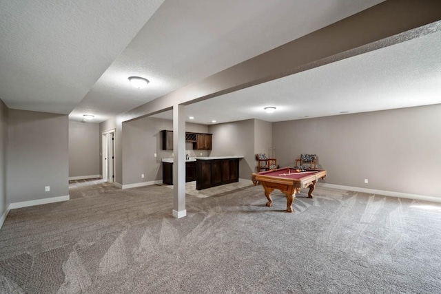 2102 NW 24th St, Ankeny, IA 50023 - playroom featuring light colored carpet, bar area, a textured ceiling, and billiards table