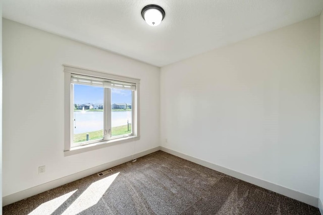 2102 NW 24th St, Ankeny, IA 50023 - spare room with carpet floors and a water view