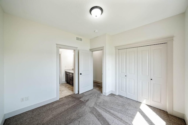 2102 NW 24th St, Ankeny, IA 50023 - unfurnished bedroom with light carpet and a closet