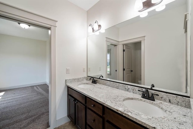 2102 NW 24th St, Ankeny, IA 50023 - bathroom featuring double vanity and toilet