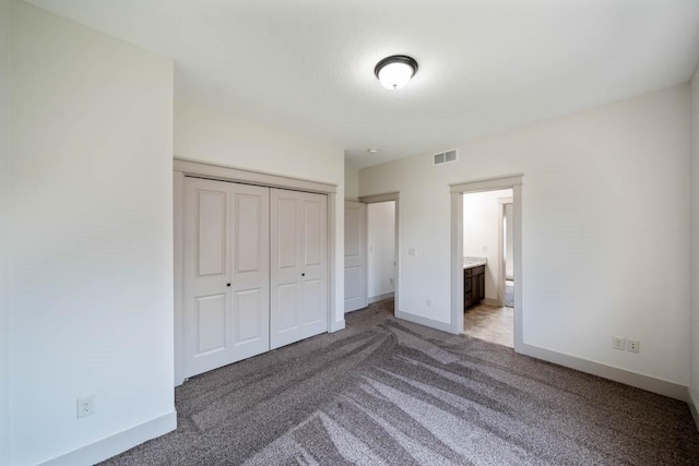 2102 NW 24th St, Ankeny, IA 50023 - unfurnished bedroom featuring light colored carpet, a closet, and ensuite bathroom