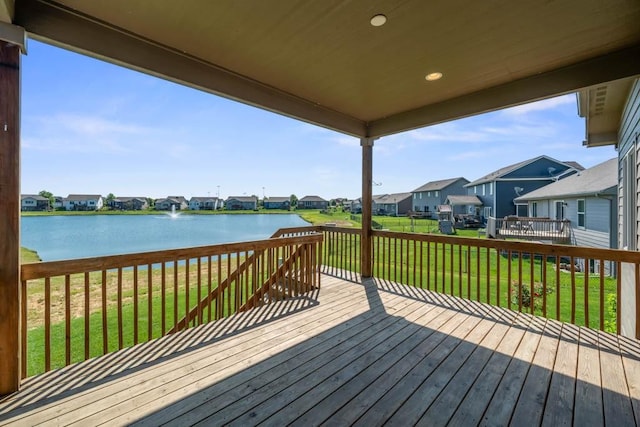 2102 NW 24th St, Ankeny, IA 50023 - wooden deck featuring a residential view, a water view, and a lawn