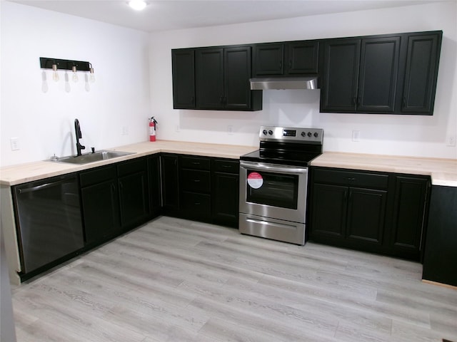408 5th St, Menlo, IA 50164 - kitchen with stainless steel appliances, a sink, under cabinet range hood, light countertops, and light wood finished floors