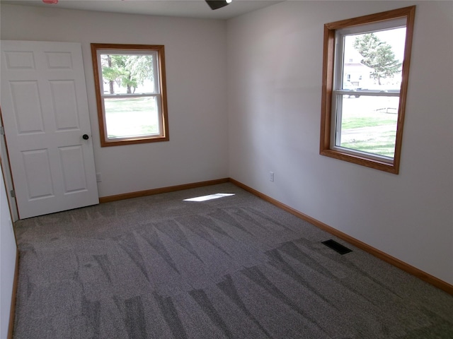 408 5th St, Menlo, IA 50164 - carpeted spare room featuring baseboards