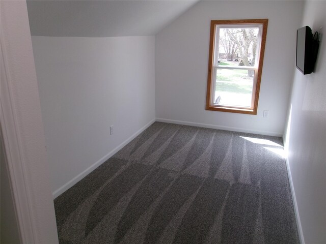 408 5th St, Menlo, IA 50164 - bonus room featuring carpet floors, vaulted ceiling, and baseboards