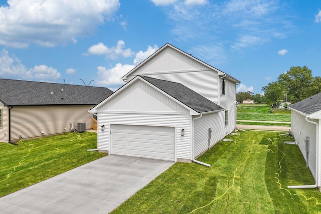 320 Veterans Blvd, Knoxville, IA 50138 - view of front of house with roof with shingles, a front lawn, concrete driveway, and board and batten siding