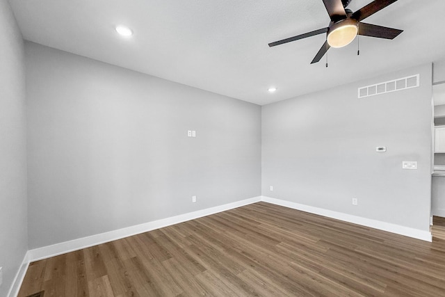 320 Veterans Blvd, Knoxville, IA 50138 - spare room with a ceiling fan, wood finished floors, and recessed lighting