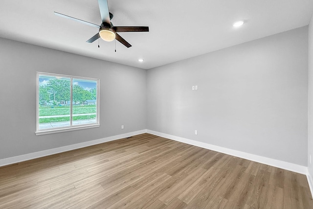 320 Veterans Blvd, Knoxville, IA 50138 - empty room featuring wood finished floors, ceiling fan, and recessed lighting