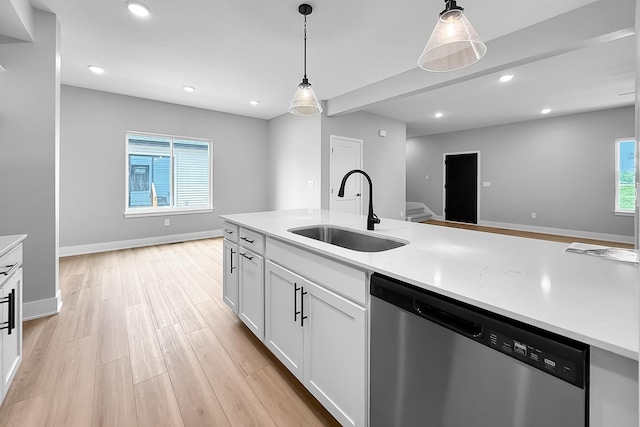 320 Veterans Blvd, Knoxville, IA 50138 - kitchen featuring stainless steel dishwasher, light wood-type flooring, recessed lighting, white cabinetry, and light countertops