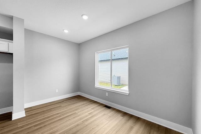320 Veterans Blvd, Knoxville, IA 50138 - empty room featuring wood finished floors and recessed lighting