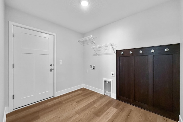 324 Veterans Blvd, Knoxville, IA 50138 - laundry area featuring electric dryer hookup, light wood-type flooring, and hookup for a washing machine