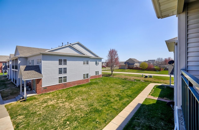 1325 SE Florence Dr Unit 211, Waukee, IA 50263 - view of property exterior with a residential view and a lawn