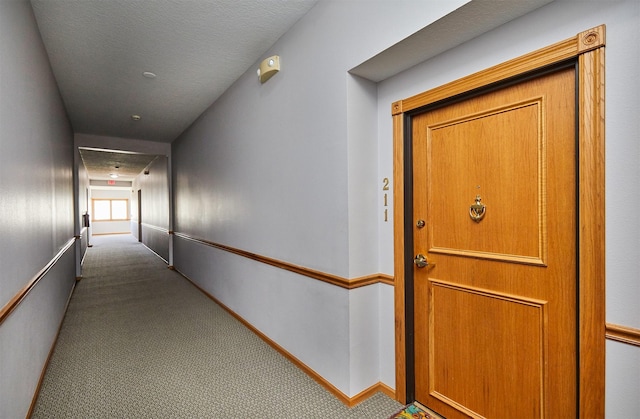 1325 SE Florence Dr Unit 211, Waukee, IA 50263 - hall featuring carpet flooring and baseboards