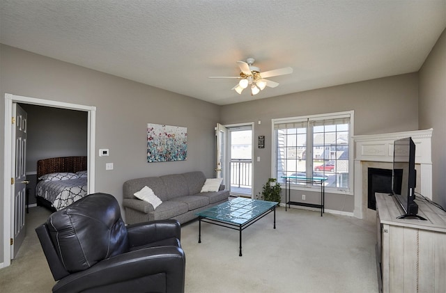 1325 SE Florence Dr Unit 211, Waukee, IA 50263 - living area with a premium fireplace, light colored carpet, ceiling fan, and baseboards