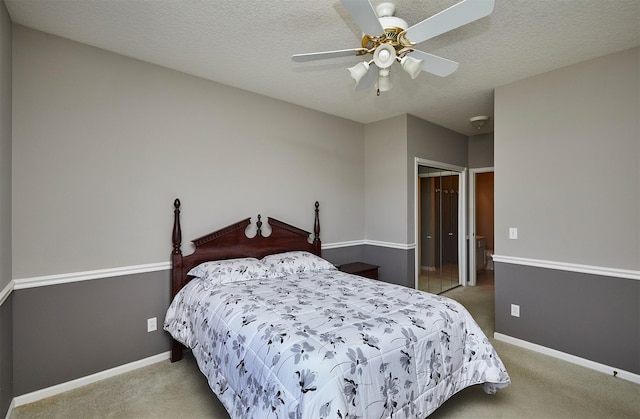 1325 SE Florence Dr Unit 211, Waukee, IA 50263 - bedroom featuring ceiling fan, a textured ceiling, a closet, carpet flooring, and baseboards