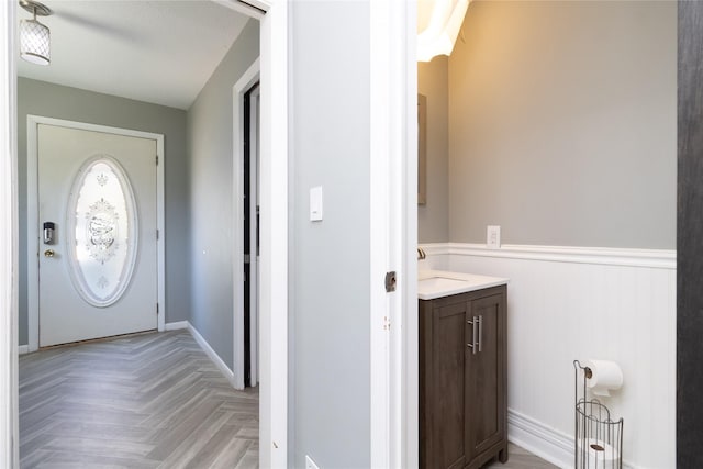 entryway featuring wainscoting