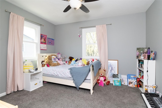 bedroom featuring a ceiling fan and carpet