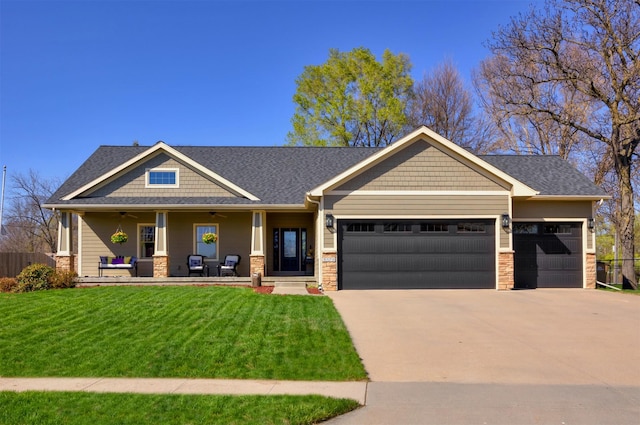 5570 Sunburst Dr, Pleasant Hill, IA 50327 - craftsman-style home with a front yard, covered porch, a garage, and concrete driveway