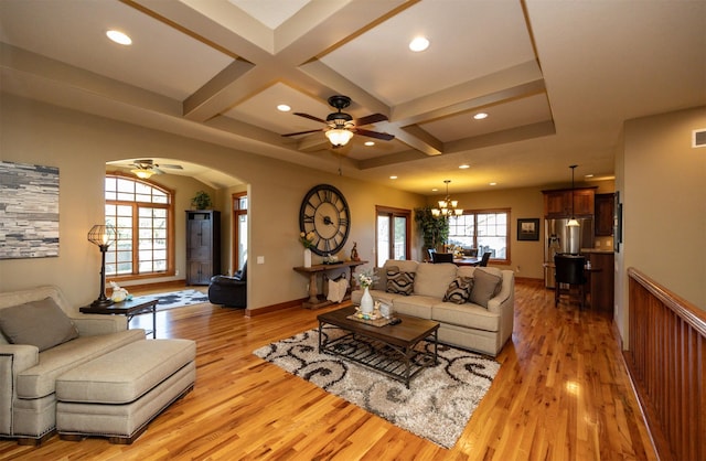 5570 Sunburst Dr, Pleasant Hill, IA 50327 - living room featuring recessed lighting, light wood-type flooring, ceiling fan with notable chandelier, and coffered ceiling