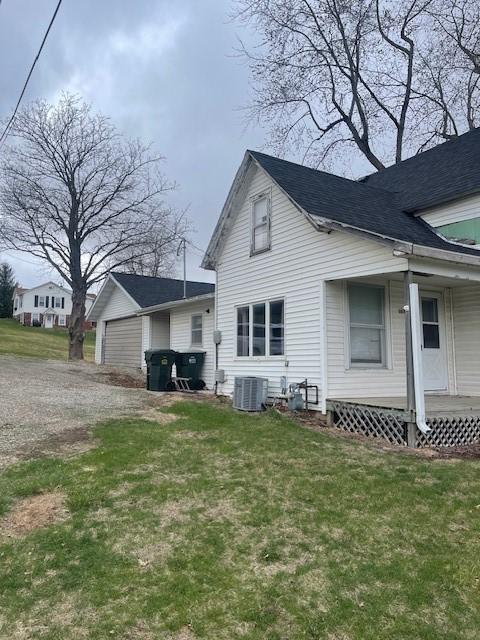 exterior space with a yard and central AC unit