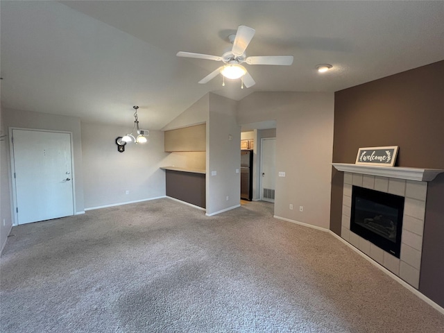 6440 Ep True Pkwy Unit 2307, West Des Moines, IA 50266 - unfurnished living room featuring a fireplace, carpet, ceiling fan, and vaulted ceiling
