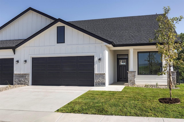 1609 Garland Ave, Norwalk, IA 50021 - modern farmhouse with a shingled roof, an attached garage, and board and batten siding
