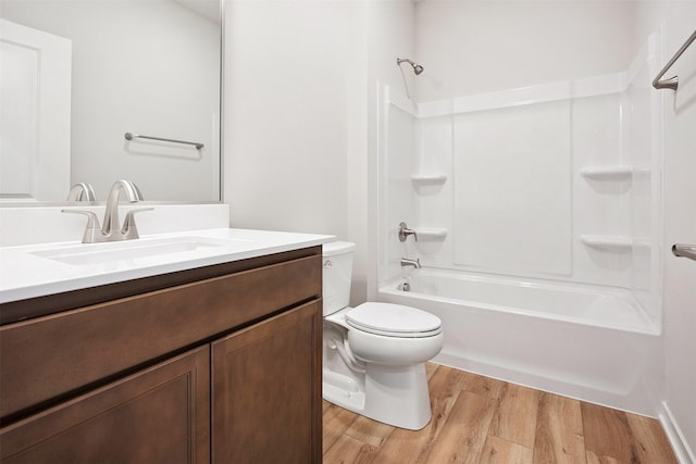 1609 Garland Ave, Norwalk, IA 50021 - full bathroom featuring wood finished floors, vanity, and shower / washtub combination
