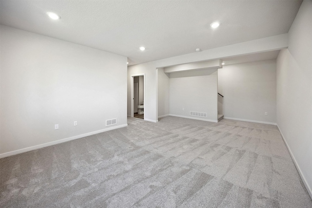 1609 Garland Ave, Norwalk, IA 50021 - below grade area with carpet, recessed lighting, and stairs