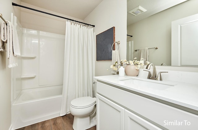 full bath with toilet, visible vents, wood finished floors, shower / bathtub combination with curtain, and vanity
