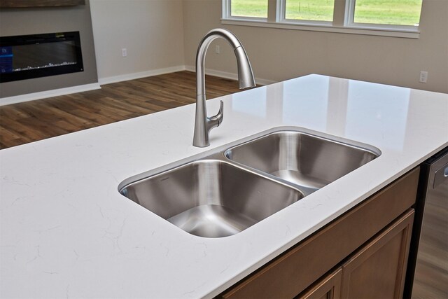 1139 NW Petersen Dr, Waukee, IA 50263 - kitchen view of dark wood-type flooring and stainless steel dishwasher