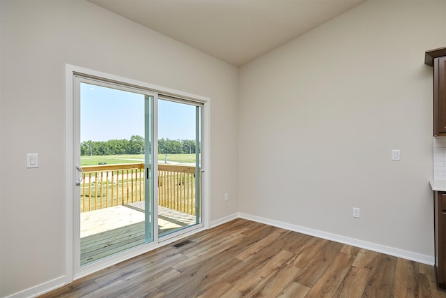 1139 NW Petersen Dr, Waukee, IA 50263 - unfurnished room with wood finished floors and baseboards