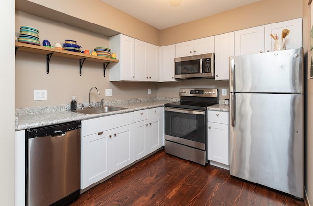 5322 Ingersoll Ave Unit B5, Des Moines, IA 50312 - kitchen featuring stainless steel appliances, dark wood finished floors, white cabinets, and light countertops