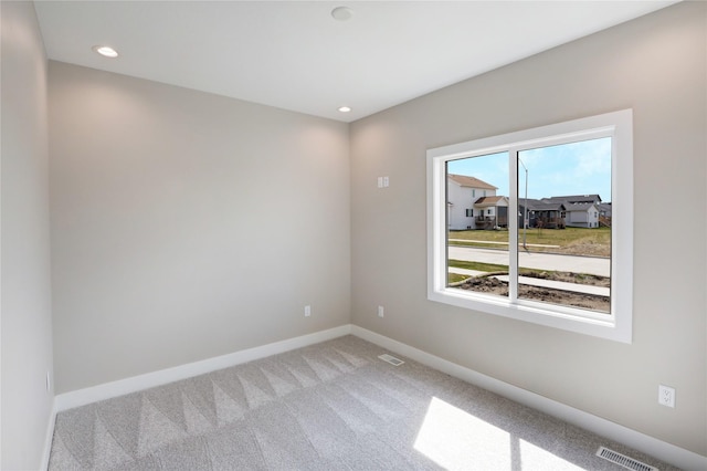 304 13th St NW, Bondurant, IA 50035 - carpeted empty room with baseboards and recessed lighting