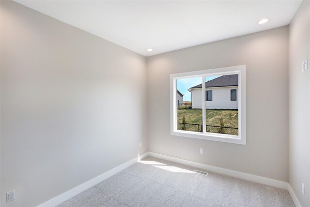 304 13th St NW, Bondurant, IA 50035 - spare room featuring baseboards, carpet, and recessed lighting