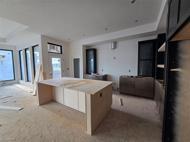 4611 Centennial Blvd, Urbandale, IA 50323 - kitchen with open floor plan, a textured ceiling, and light carpet