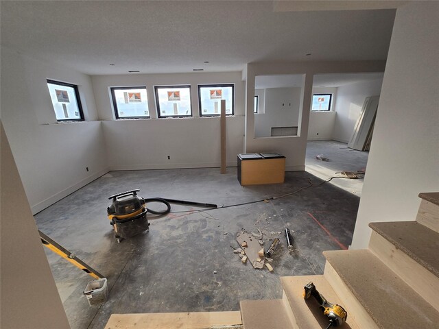 4611 Centennial Blvd, Urbandale, IA 50323 - unfurnished living room with healthy amount of natural light