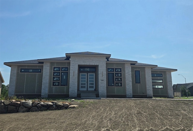 4611 Centennial Blvd, Urbandale, IA 50323 - prairie-style house featuring entry steps
