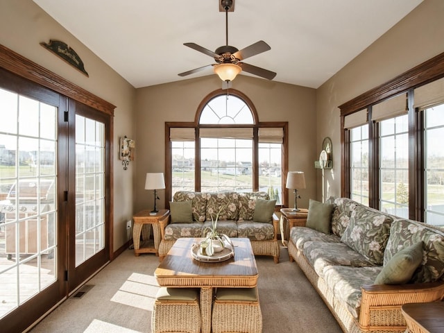 1835 SE Hillside Dr, Ankeny, IA 50021 - living area with healthy amount of natural light, carpet flooring, ceiling fan, and lofted ceiling