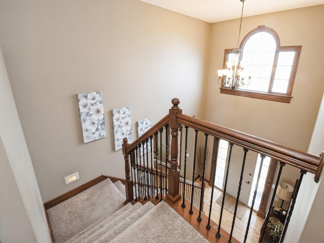 1835 SE Hillside Dr, Ankeny, IA 50021 - staircase with a chandelier and baseboards
