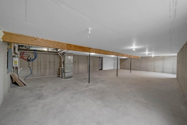 unfinished basement with heating unit
