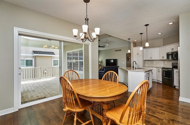 dining space with visible vents, baseboards, dark wood-style flooring, and an inviting chandelier